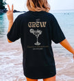 Cincerely Yours Bachelorette Shirt in Schwarz mit 'The Crew' Aufdruck und Margarita-Grafik, ideales Hen Party Shirt für den JGA am Strand, Rückansicht.