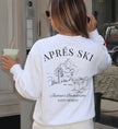 Rückansicht eines weißen JGA Sweaters von Cincerely Yours mit künstlerischem Backprint, der eine Ski-Szene und feierliche Cocktails für die Bachelorette Party zeigt.