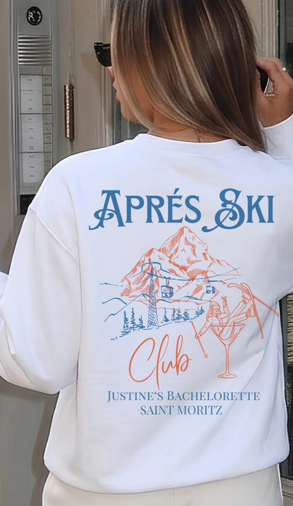Rückenansicht eines weißen Cincerely Yours Sweatshirts mit blau-orangefarbenem Aprés Ski Club Backprint, Berg-Grafik und Cocktail-Design, hochwertige Passform.