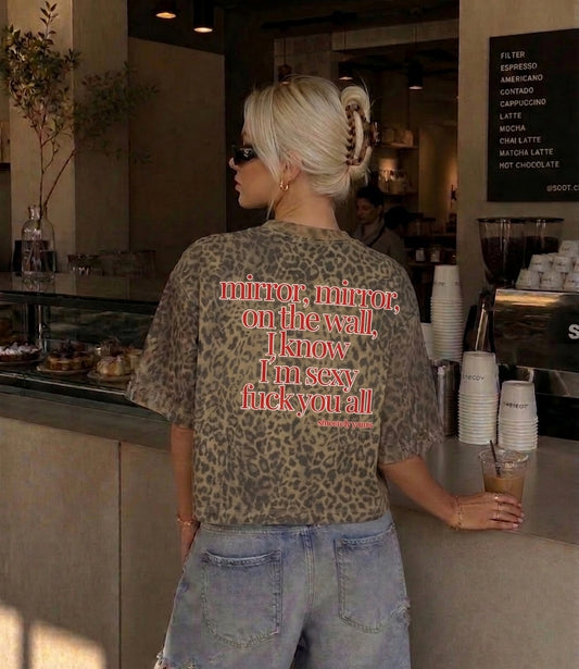 A boxy unisex leopard print T-Shirt from Cincerely Yours featuring a provocative I know I am sexy quote for strong and confident women.
