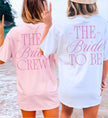 Detailed view of personalized bachelorette t-shirt back print showcasing custom event date and location in classic preppy varsity font.